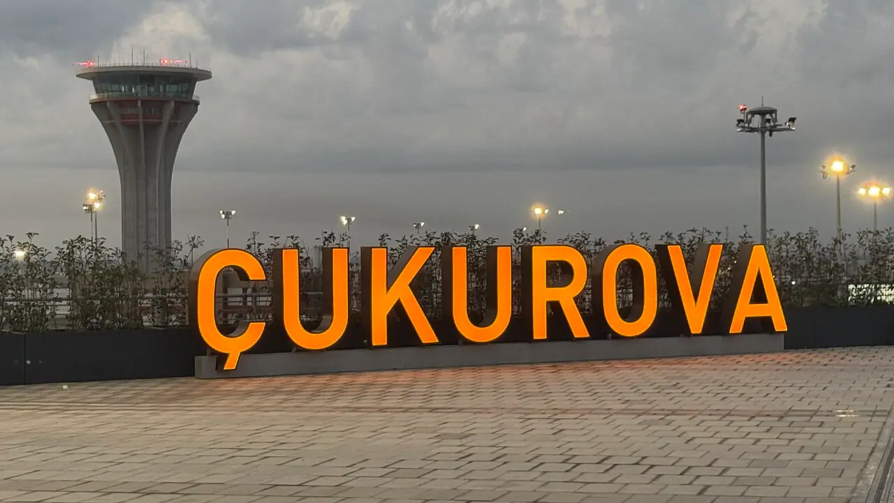 The Çukurova sign and control tower at Çukurova International Airport