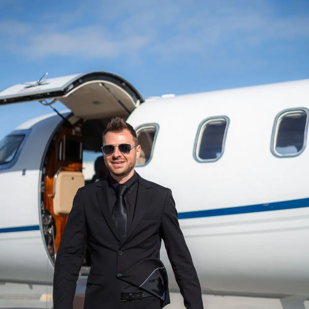 Business traveller stepping off a private jet